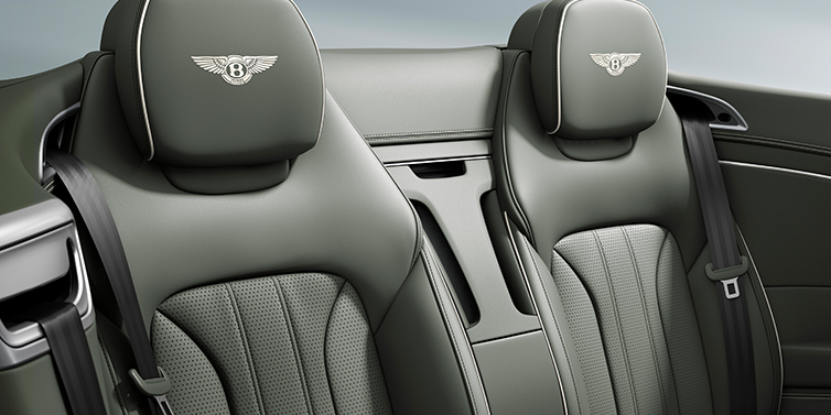 Bentley Dubai New Bentley Continental GTC convertible rear interior in Beluga black hide featuring contrast piping and Bentley wings headrest emblems